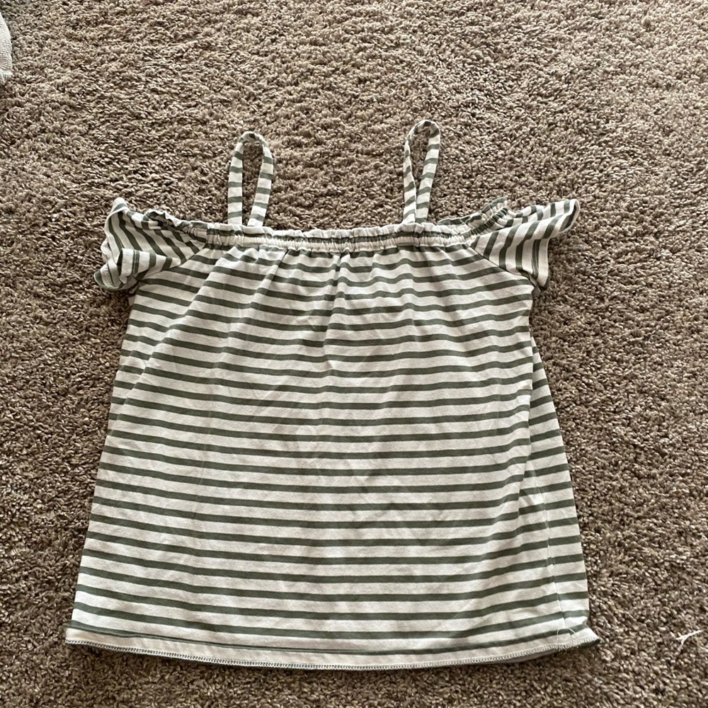 Green striped shirt.